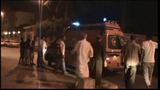 An ambulance ferries the injured