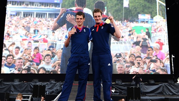 The Brownlee brothers' show off their medals in Hyde Park.