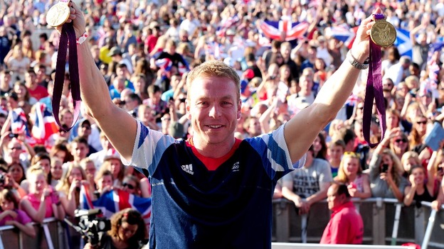 Sir Chris Hoy shows off his gold medals at BT London Live in Hyde Park.