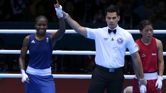 Great Britain's Nicola Adams (left) defeats India's Chungneijang Mery Kom Hmangte during the Women's Boxing Fly (48-51kg) Semi Final