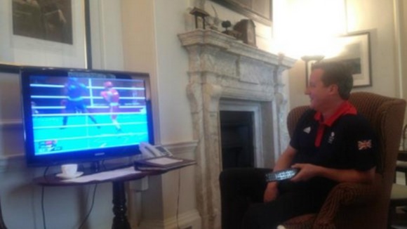 Prime Minister David Cameron watches Britain's Nicola Adams win Olympic gold.