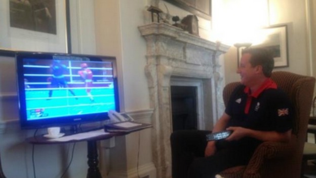 Prime Minister David Cameron watches Britain's Nicola Adams win Olympic gold.