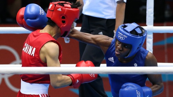 Adams lands a heavy punch.