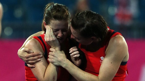Great Britain's Helen Richardson is consoled by Kate Walsh (right) after defeat to Argentina in the semi-finals.