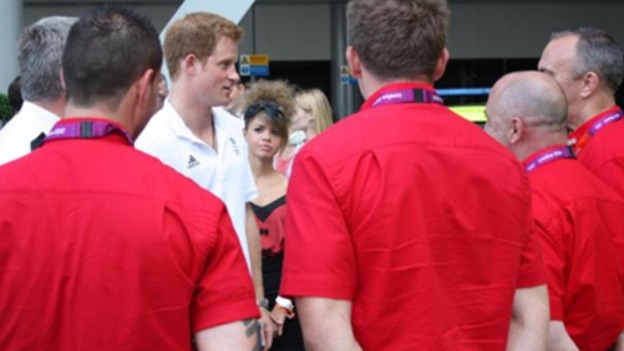Prince Harry talks to volunteers.