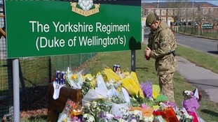 Flowers at the base of Yorkshire regiment barracks