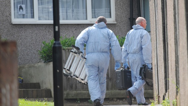 Forensic police officers leave the home of Christine Sharp, grandmother of missing school girl Tia Sharp