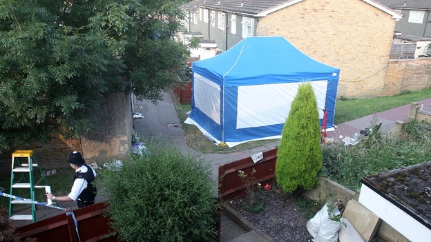 Police tent set up outside the home of Christine Sharp