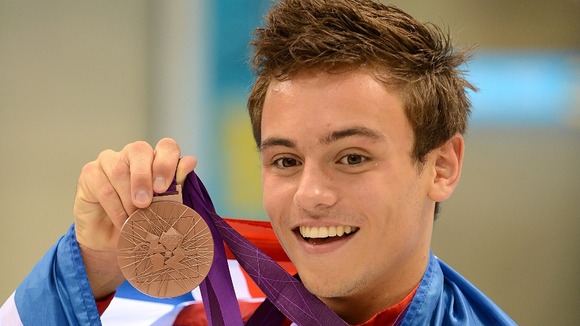 Great Britain's Tom Daley as he celebrates his bronze medal in the men's 10m platform final.