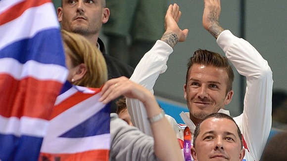 David Beckham watches on from the stands.