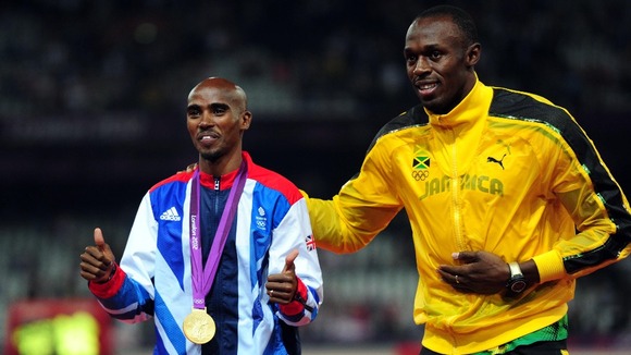 Bolt congratulates Farah on his 5,000m gold medal success.