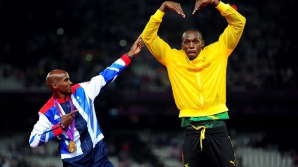 Usain Bolt and Mo Farah celebrate Mo's gold medal