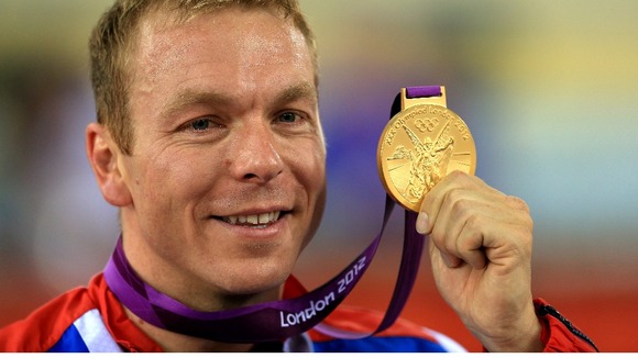 Great Britain's Sir Chris Hoy celebrates winning a gold medal