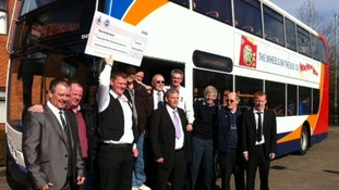 Corby bus drivers collect their winnings