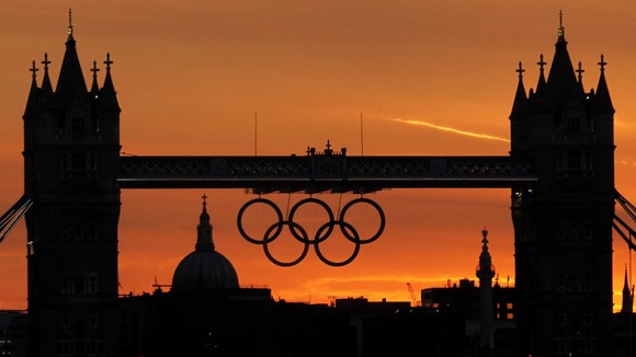 Sun sets behind the Olympic rings on Tower Bridge