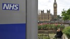 NHS with House of Commons in the background