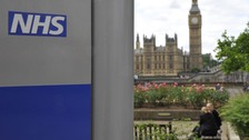 NHS with House of Commons in the background