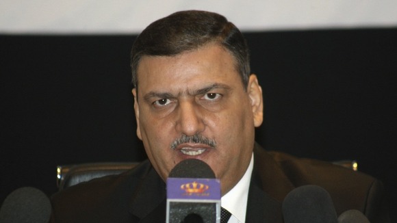efected Syrian Prime Minister Riyad Hijab speaks during a news conference in Amman