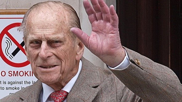 The Duke of Edinburgh waves as he leaves King Edward VII Hospital in central London after being treated for a bladder infection.