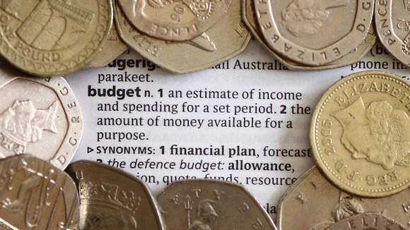 Coins surrounding the word budget
