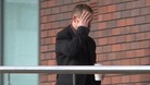 Graham Leith arrives at court covering his face