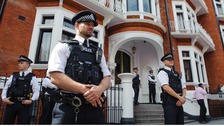 Police officers outside the Embassy of Ecuador in Knightsbridge, central London