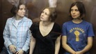 Pussy Riot members listen to the judge's guilty verdict