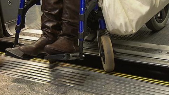 Tamisha's wheelchair gets stuck between the platform and the tube