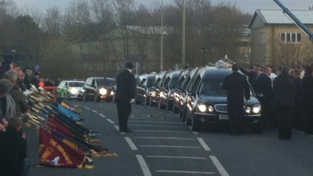 The cortege carrying the bodies of six soldiers killed in Afghanistan arrives in Carterton