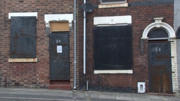 Empty houses stand waiting for owners