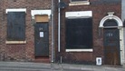 Empty houses stand waiting for owners