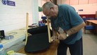 Workers repairing chairs