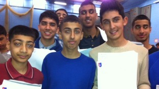Students together with their GCSE results