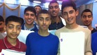 Students together with their GCSE results