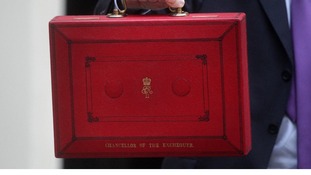 Chancellor of the Exchequer George Osborne holds up his ministerial red box in 2011