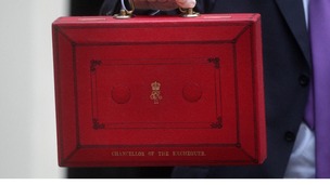 Chancellor of the Exchequer George Osborne holds up his ministerial red box in 2011