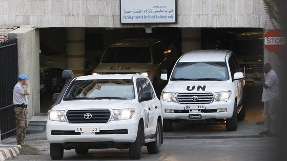 UN vehicles transport members of the United Nations observers mission out of Damascus as they leave Syria