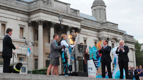 Claire was steadied as she passed the torch over the Cauldron