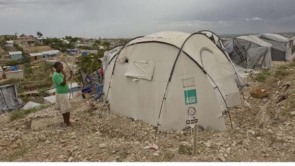 Residents of a camp for displaced people of the 2010 earthquake remain in their camp asf tropical storm Isaac bears down on Port au Prince