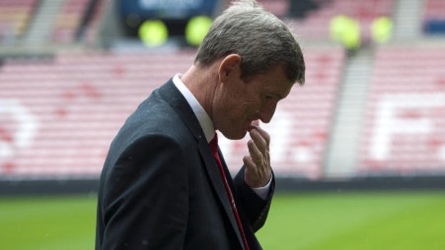 Sunderland's chariman Ellis Short inspects the pitch