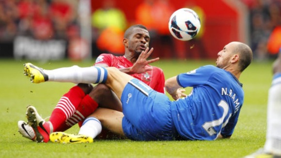 Wigan's Ivan Ramis in action against Southampton's Guly Do Prado (left)