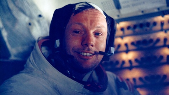 Neil Armstrong smiles in the lunar module after his historic moonwalk