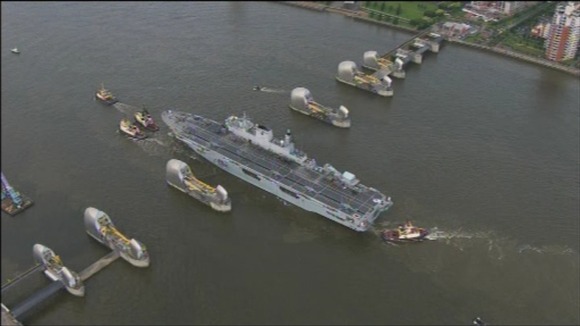 HMS Ocean passes through the Thames