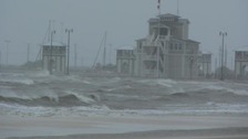 The Harbormaster's building in Gulfport Mississipi flying hurricane flags