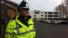 Police guard the school gates at Baxter College where Luke Chapman collapsed and died