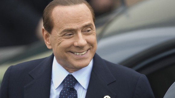 Silvio Berlusconi arrives for an evening dinner function at the G8 summit in Deauville in 2011