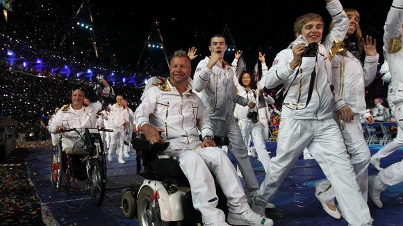 Lee Pearson (centre) and members of Great Britain's Paralympic Team make their way out during last night's Opening Ceremony