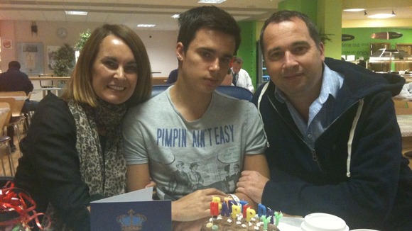 Oliver Lilburn, centre, with his parents Justine and Colin