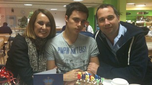 Oliver Lilburn, centre, with his parents Justine and Colin