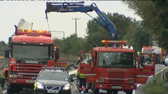 Salvage crews clear away the wreckage